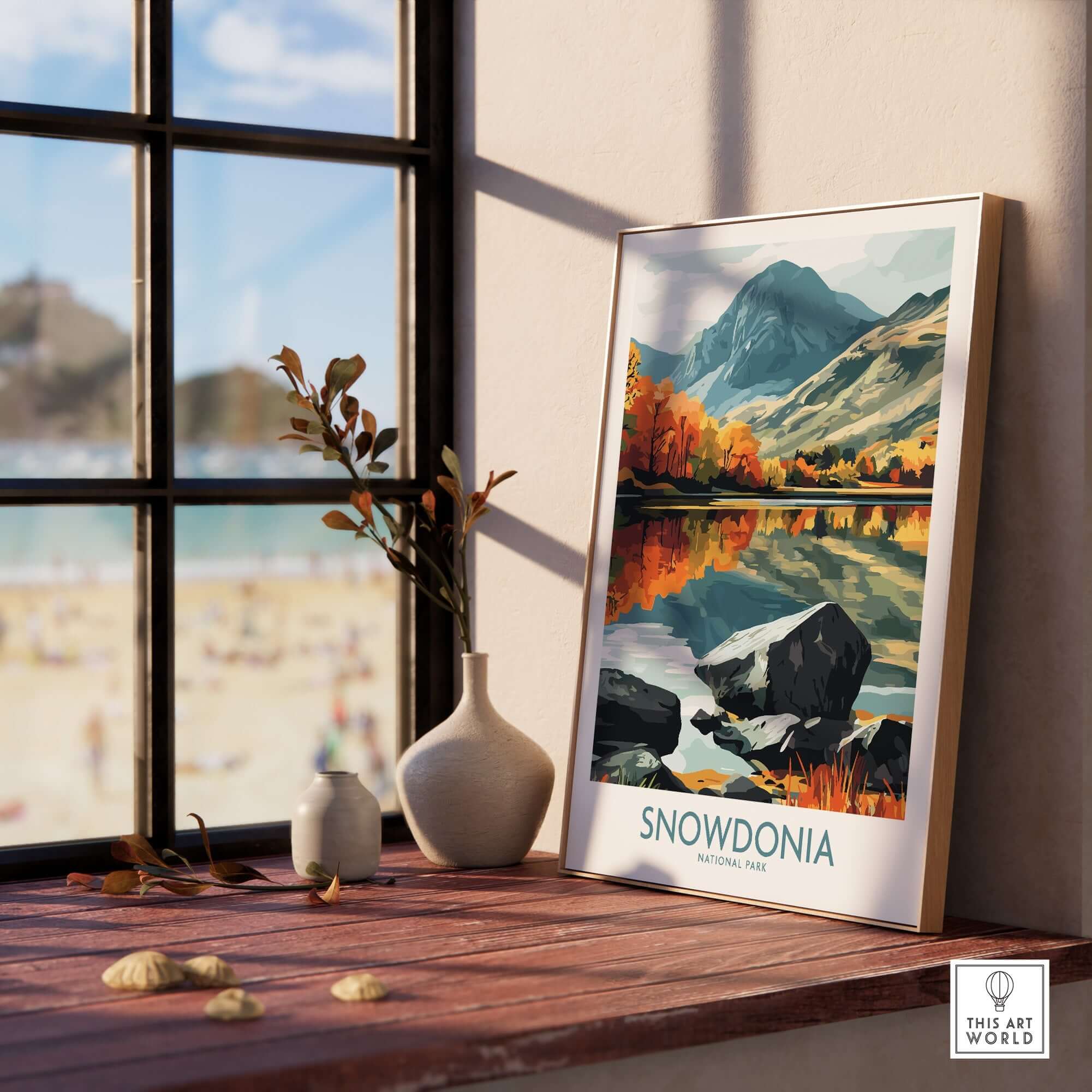 Snowdonia National Park Poster displayed on a wooden shelf with scenic landscape and vibrant colors.