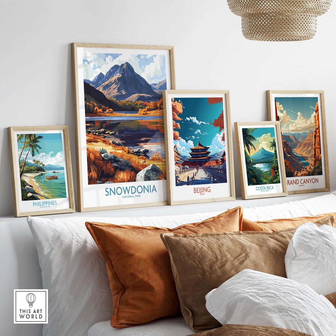 Beautiful collection of framed travel posters including Snowdonia, showcasing vibrant landscapes and adventure destinations.