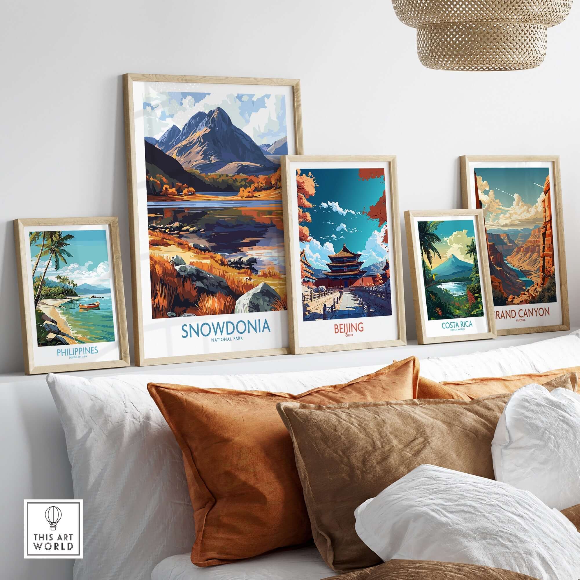 Snowdonia National Park Poster Wales displayed among travel posters in a stylish home setting.