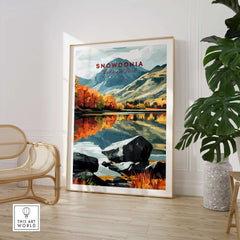 Snowdonia National Park Print displayed in a stylish interior with autumn colors and reflection in water.