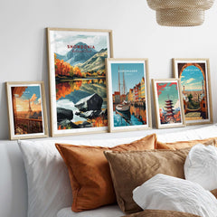 Snowdonia National Park Print and other vibrant travel prints displayed on a cozy sofa.