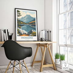 Snowdonia National Park Travel Poster displayed in a stylish home office interior with a mountain landscape.