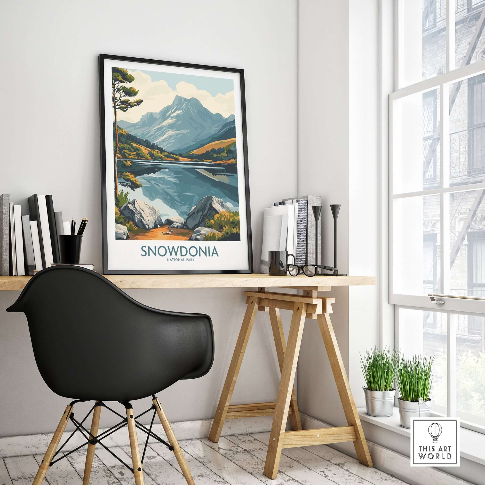 Snowdonia National Park Travel Poster displayed in a stylish home office interior with a mountain landscape.