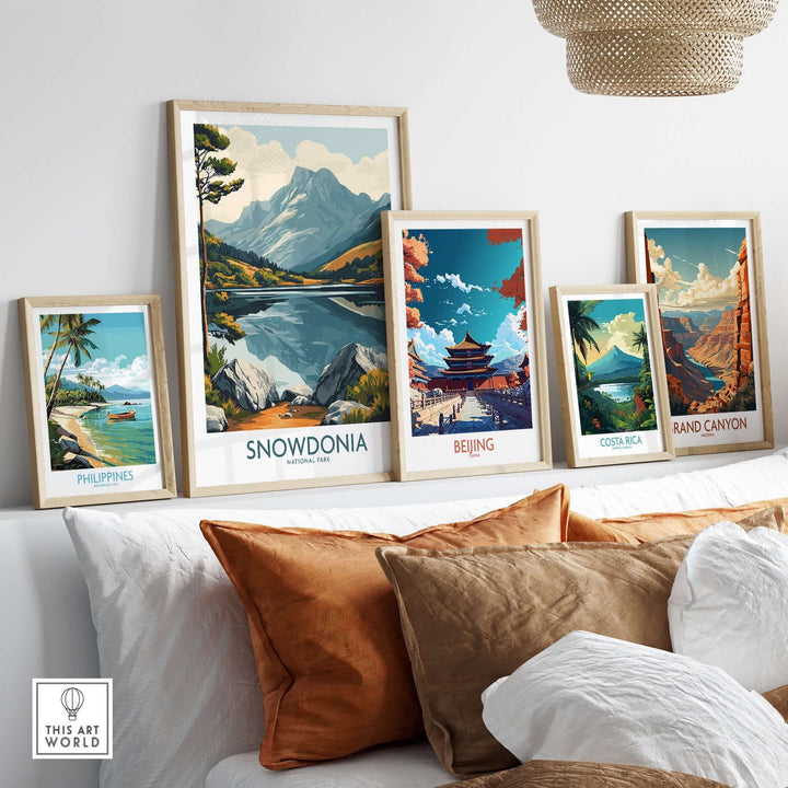 Stylish living room display with travel posters of Snowdonia, Beijing, Costa Rica, and the Grand Canyon.