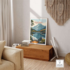 Snowdonia National Park Travel Print displayed in a cozy living room setting, showcasing vibrant landscapes.