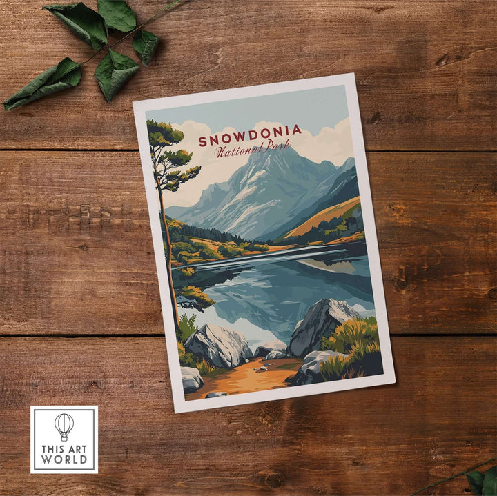 Snowdonia National Park travel print featuring vibrant landscapes and mountains against a serene lake backdrop.