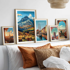 Five colorful travel posters including Snowdonia National Park Wales Poster displayed in a modern living room setting.