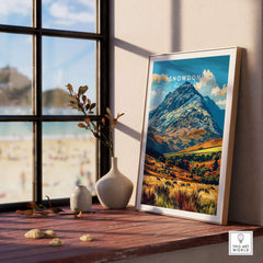 Snowdonia National Park Wales Poster displayed in a scenic home setting near a window.