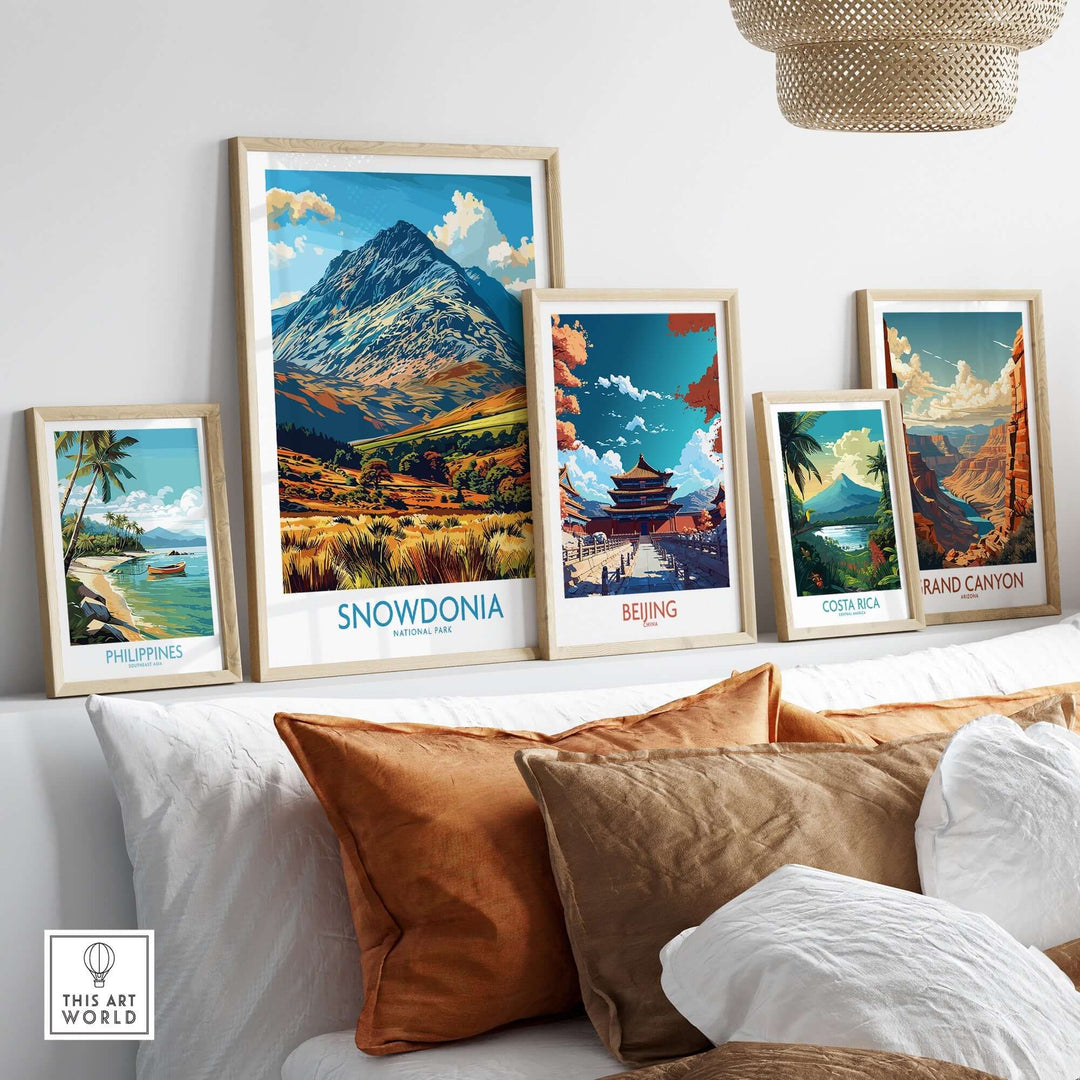 Framed prints of Snowdonia, Beijing, Costa Rica, and the Grand Canyon displayed in a stylish interior setting.