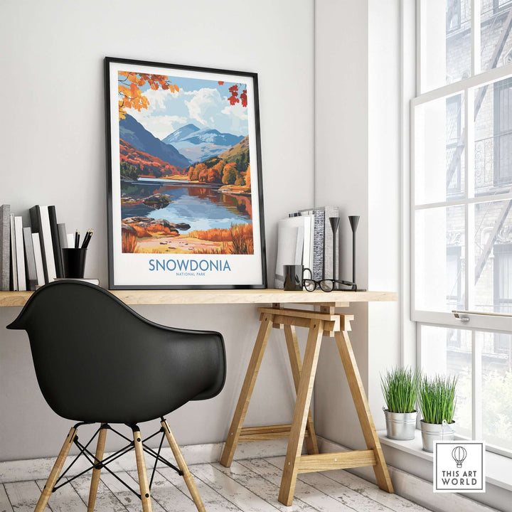 Snowdonia National Park travel print displayed in a modern home workspace, showcasing vibrant autumn colors and scenic landscapes.