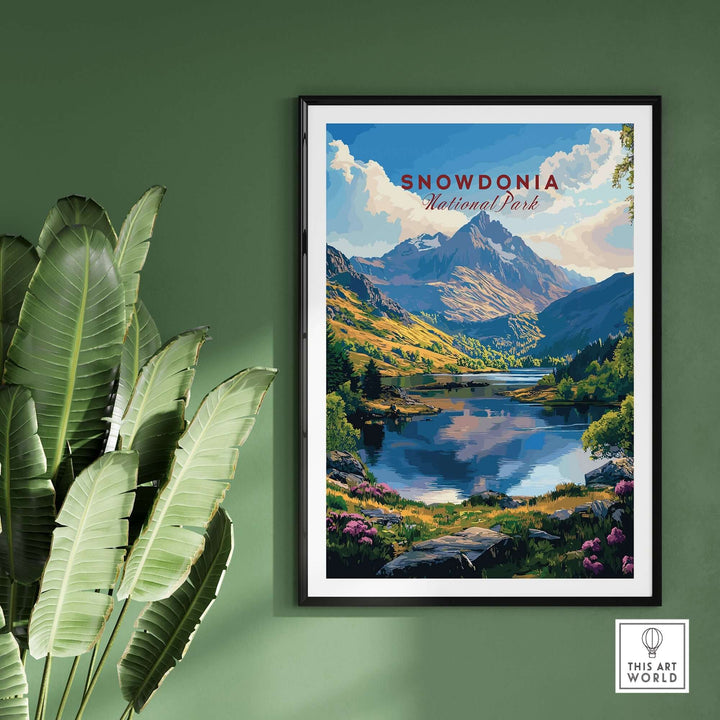 Snowdonia National Park wall art poster showcasing stunning mountains and a serene lake, framed on a green wall.