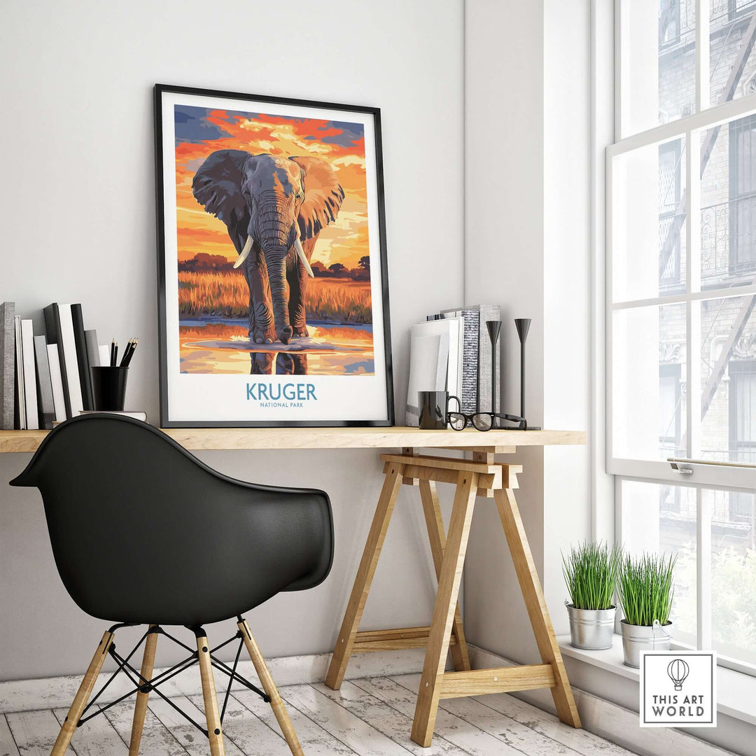 South Africa elephant poster at desk, showcasing Kruger Park sunset landscape art in a modern interior setting.