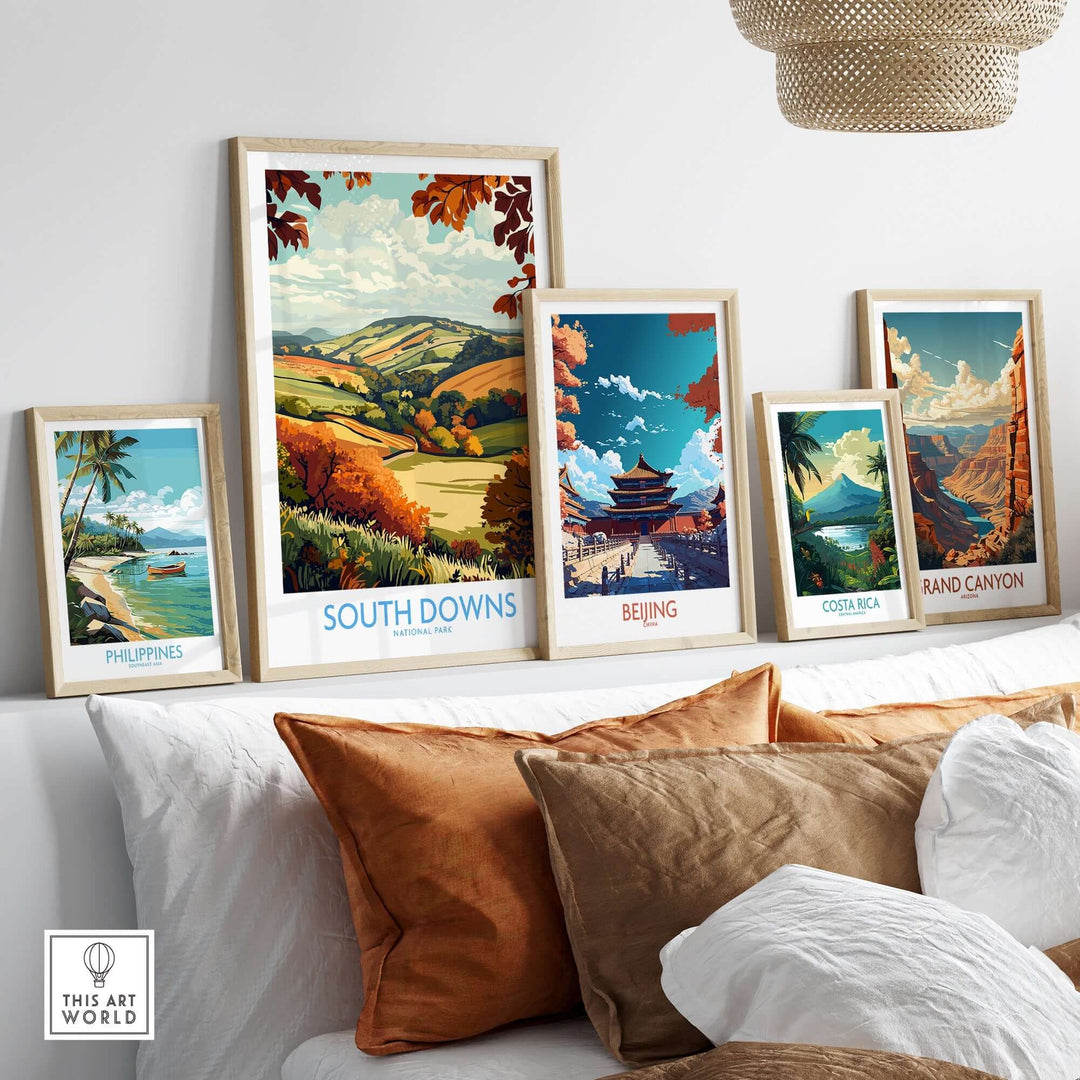 South Downs National Park art print displayed among other scenic travel prints on a modern shelf.