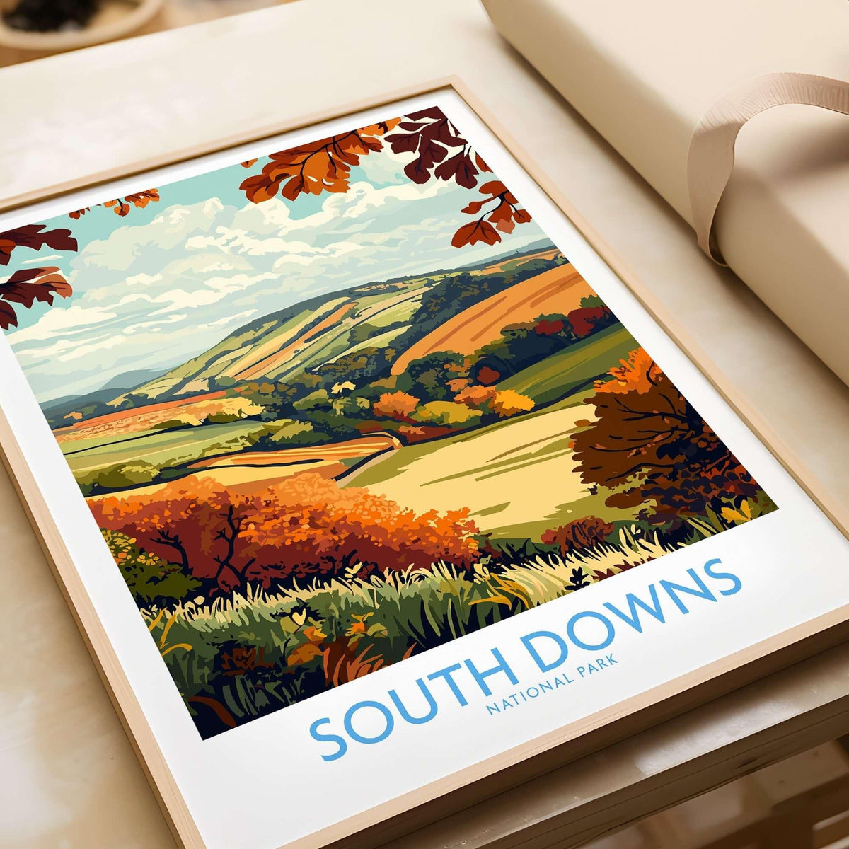 South Downs National Park Art Print displayed on a tabletop, showcasing vibrant autumn colors and scenic landscapes.
