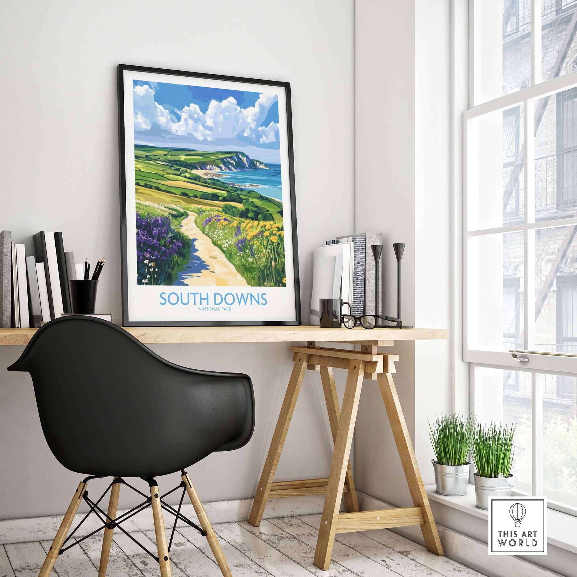 South Downs National Park Poster England displayed on a wall in a modern home office setting.