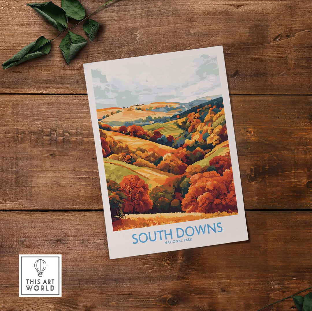 South Downs National Park travel poster showcasing vibrant autumn colors and scenic landscapes on a wooden table.