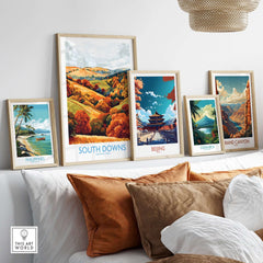 Colorful travel posters including South Downs National Park Travel Poster displayed in a stylish living room setting.