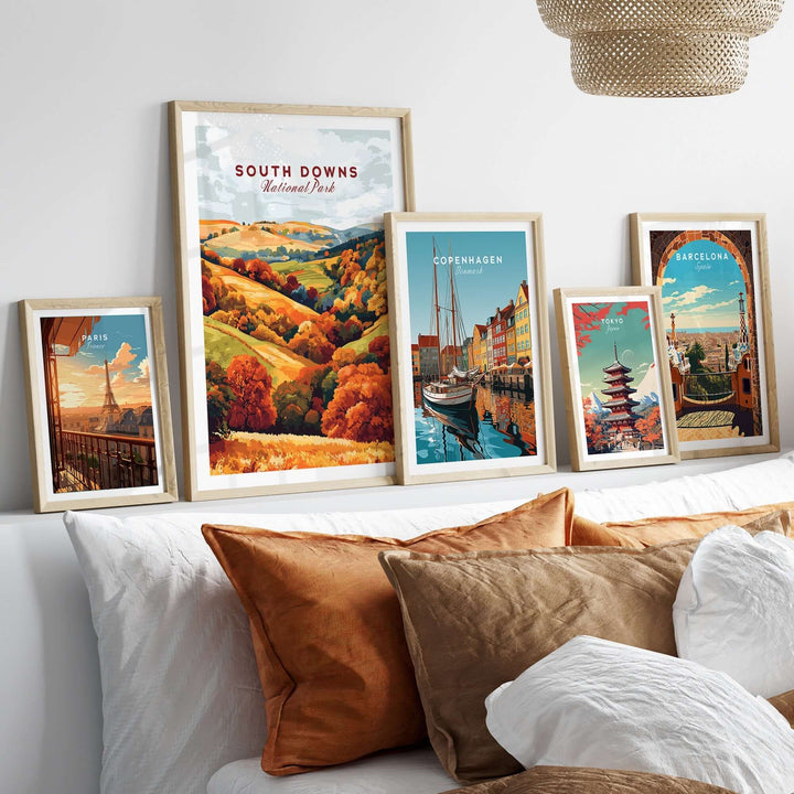 South Downs National Park travel print showcased among framed artwork, featuring vibrant autumn colors and a cozy home decor setting.