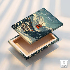 St. Anton Wall Art elegantly displayed on a wooden box, capturing the charm of St. Anton's landscapes.