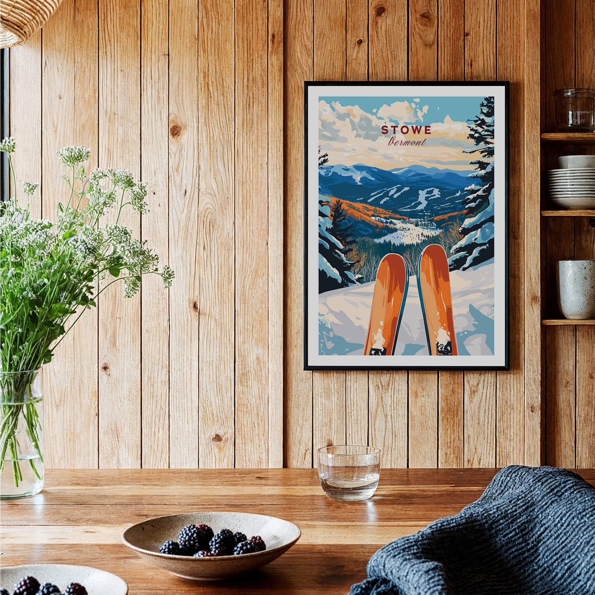 Ski Poster Stowe Vermont displayed in a cozy wooden interior with skis and a scenic mountain backdrop.