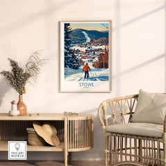 Framed Stowe Vermont ski village art print showcasing a winter mountain view in a cozy home setting.