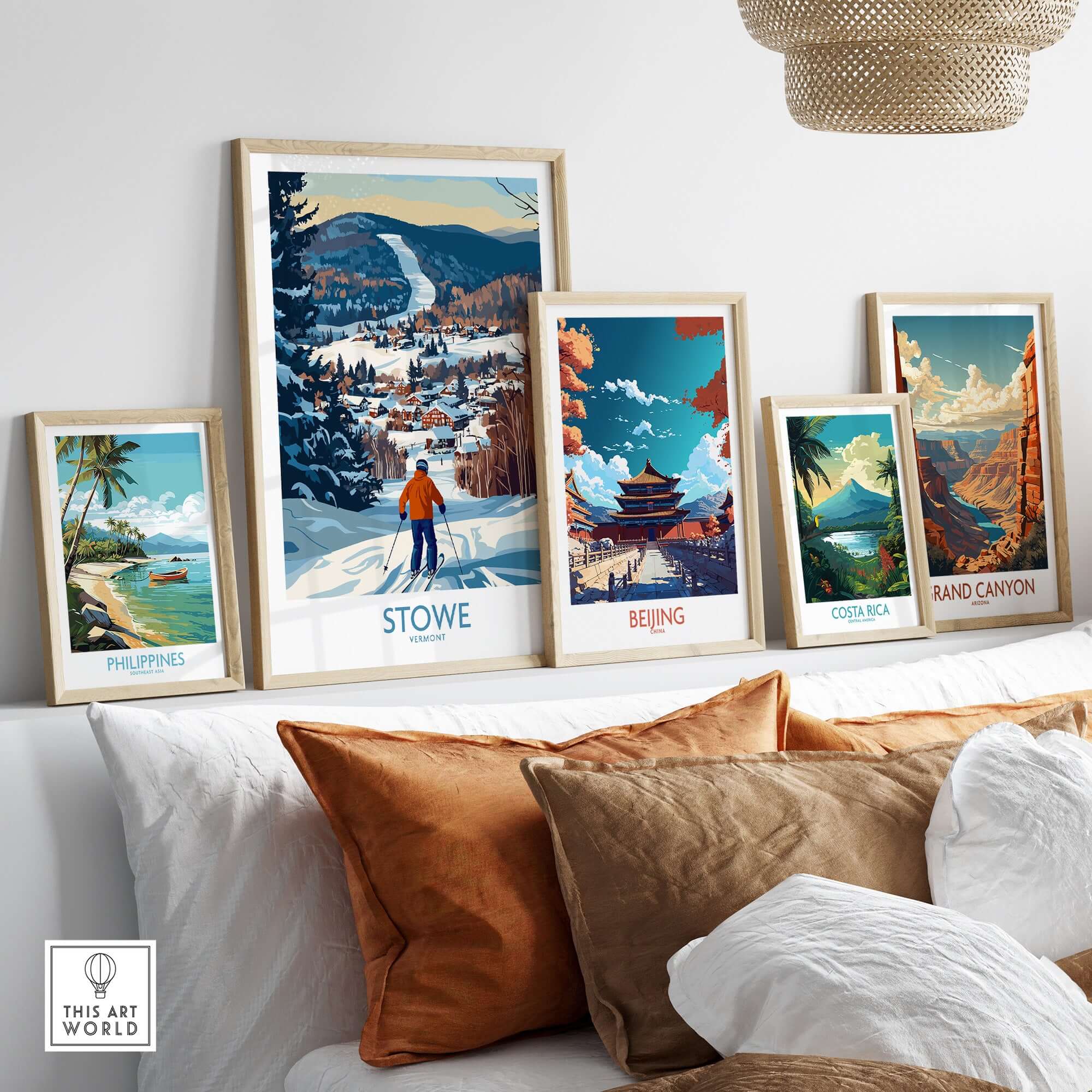 Stylish wall display of travel art prints including Stowe Vermont and other scenic locations.
