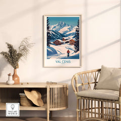 Val Cenis ski art print featuring a skier amid snow-covered mountains and chalets, perfect for winter decor.