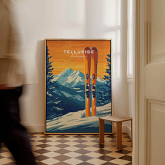 Telluride Travel Poster - Colorado featuring vibrant ski print and stunning mountain backdrop in a cozy interior setting.