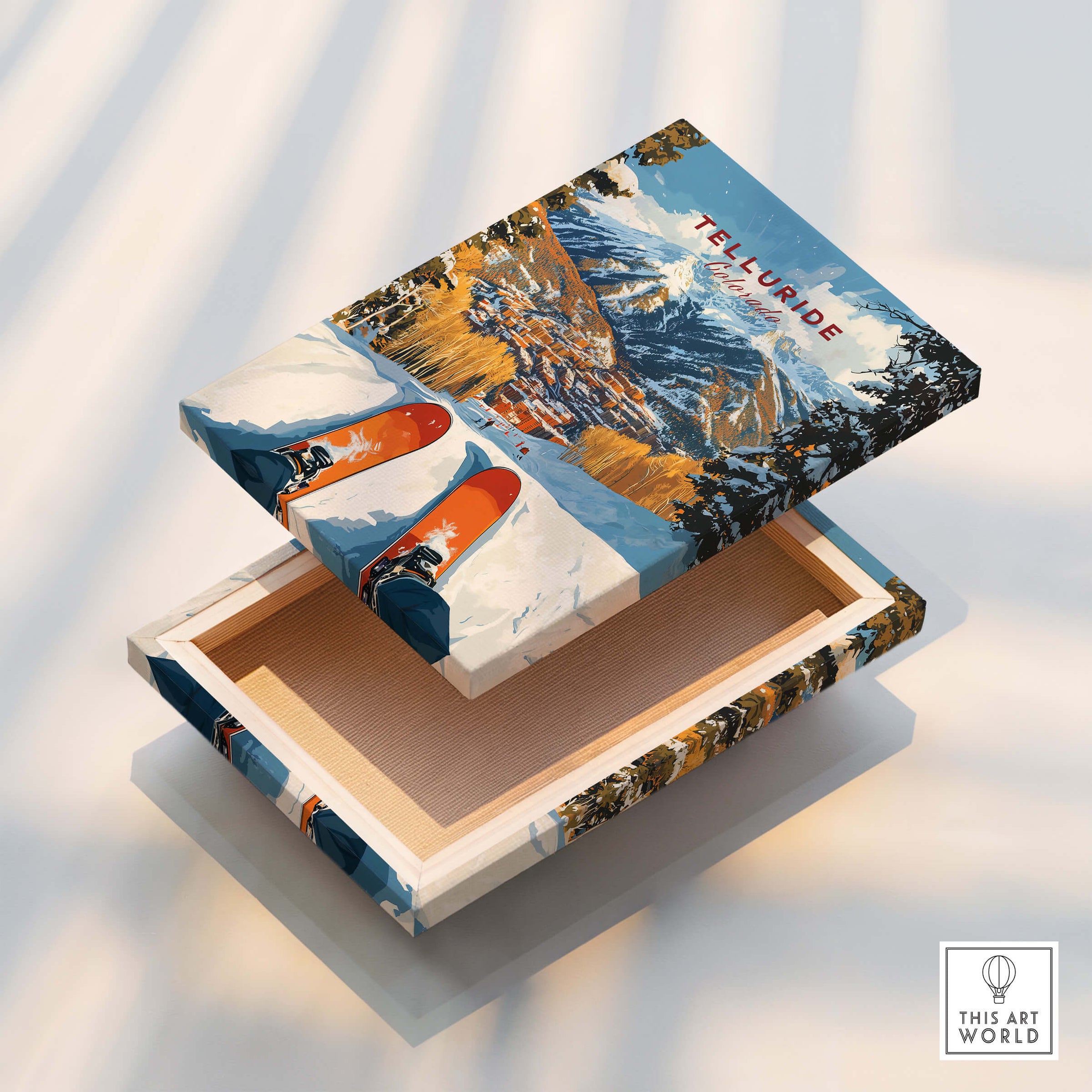 Telluride Ski Poster design on a decorative box showcasing a vibrant ski scene and snowy mountains.