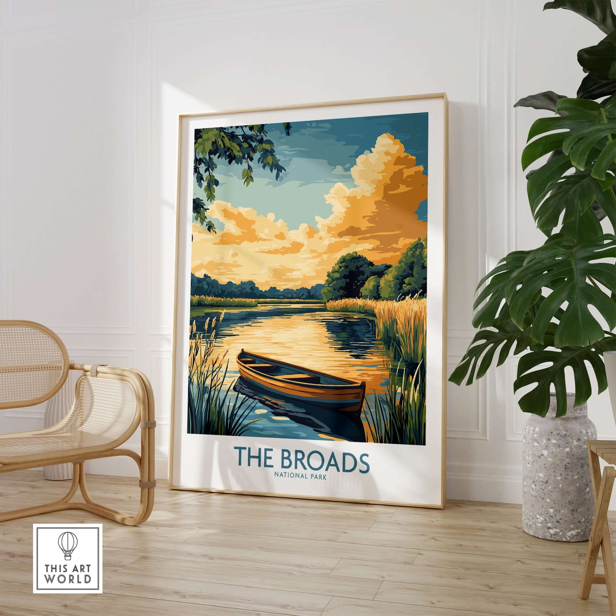 The Broads National Park Art Print showcasing a serene river scene with a boat and vivid sunset.