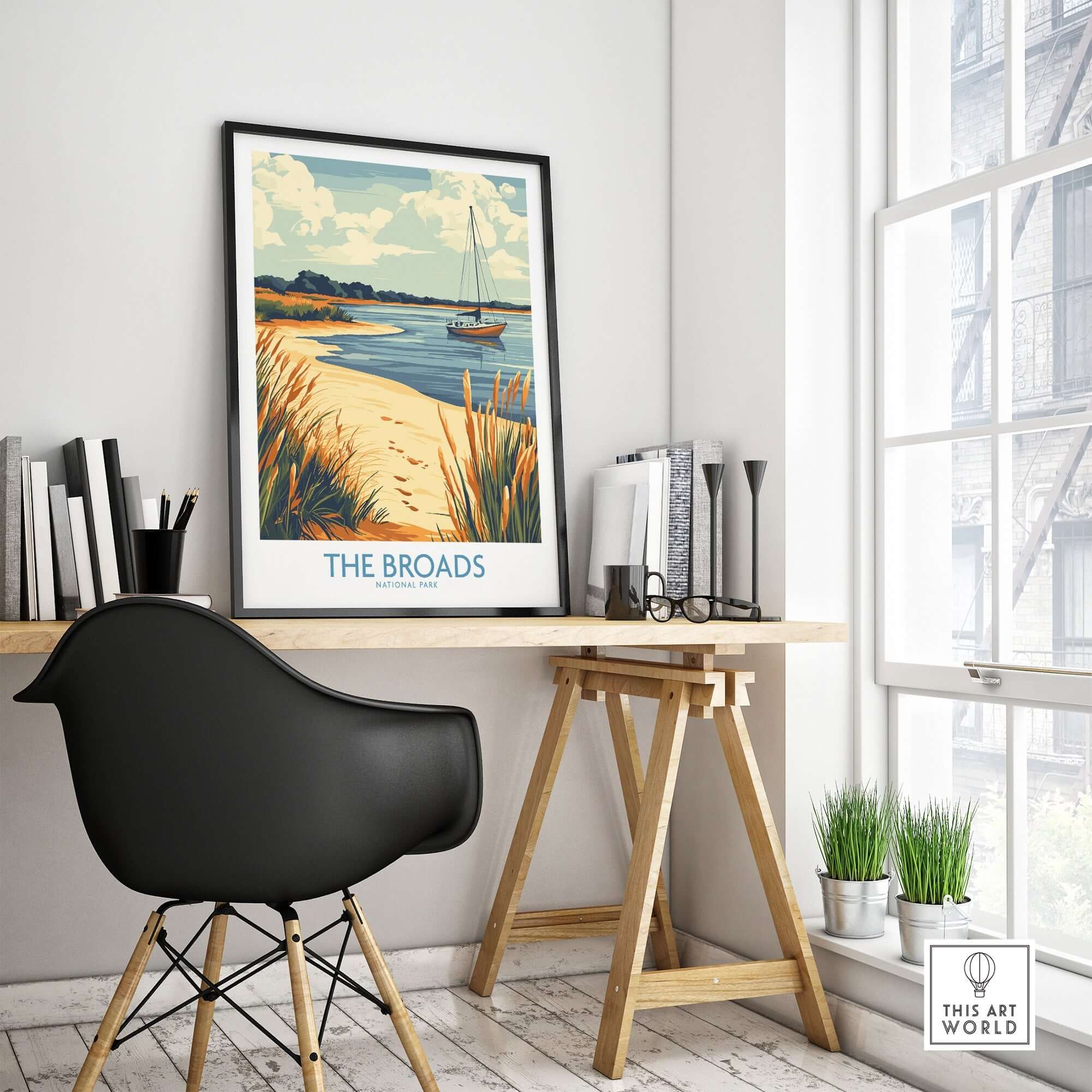 The Broads National Park Poster displayed in a stylish home office setting with a black chair and natural lighting.