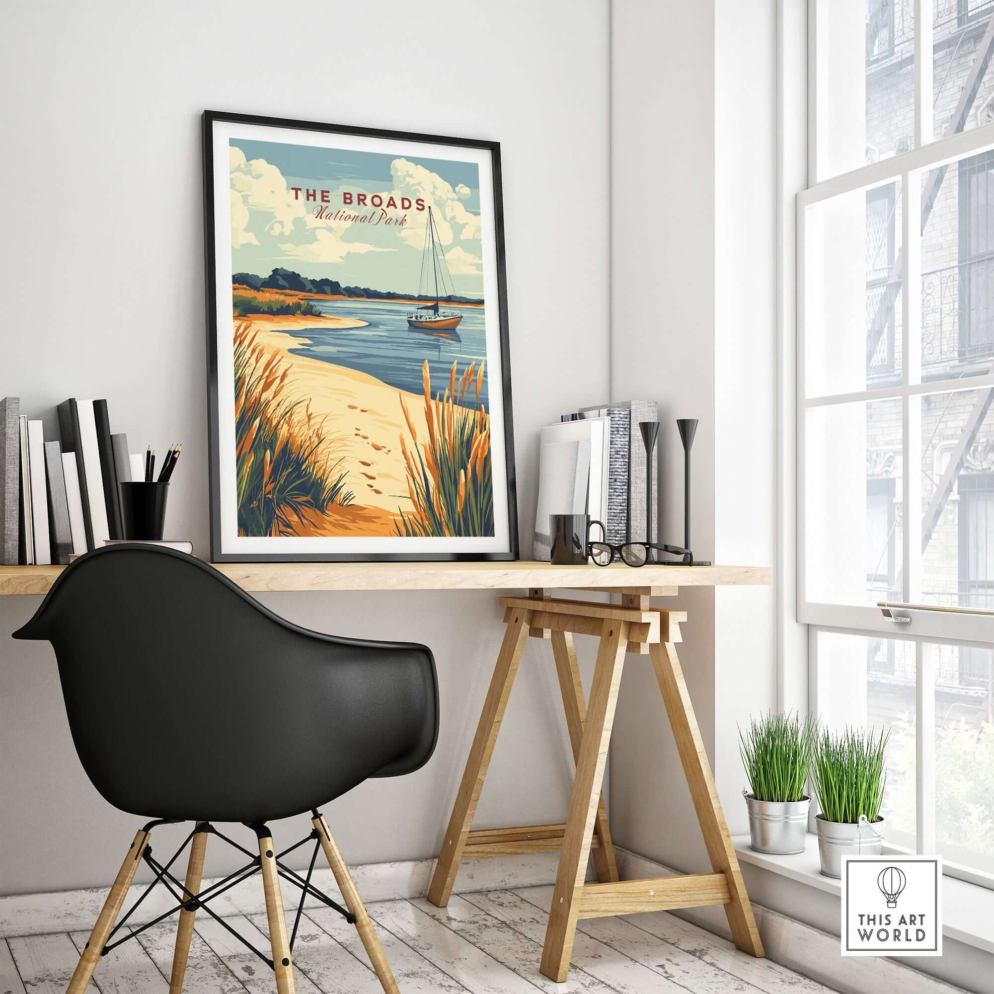 The Broads National Park Print displayed in a modern home office setting, featuring vibrant colors and natural scenery.
