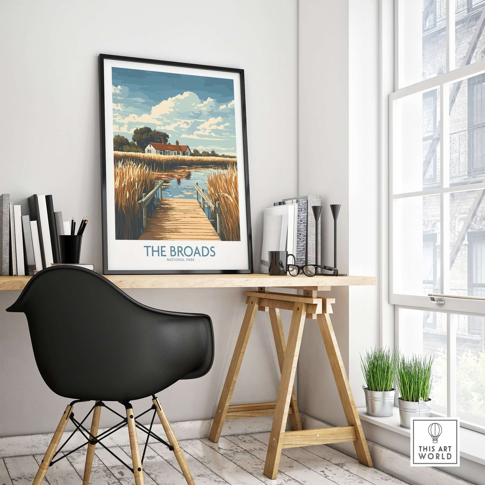 The Broads National Park Travel Poster displayed in a stylish interior with a desk and natural light.