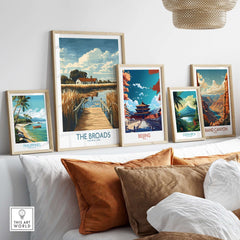 The Broads National Park Travel Poster among various travel posters displayed on a wall.