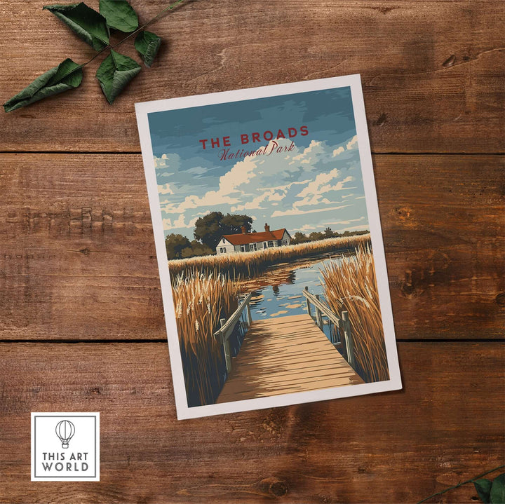 The Broads National Park travel print featuring serene landscapes and wildlife on a wooden table. Perfect for nature lovers.