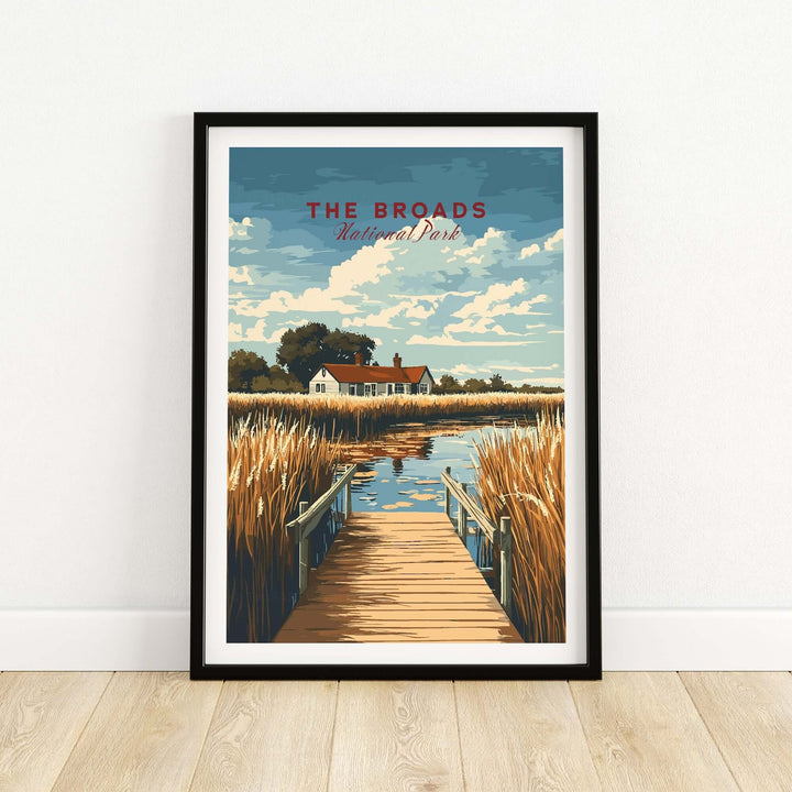 Broads National Park travel print featuring a scenic landscape with water, reeds, and a house under a blue sky.