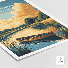 The Broads National Park Wall Art featuring serene scenery with a boat on tranquil waters and vibrant clouds.