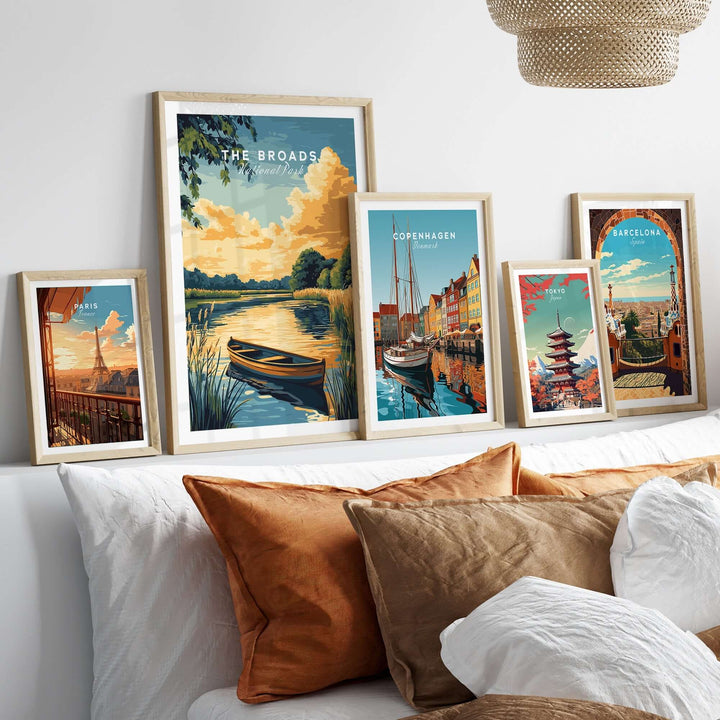 Broads National Park wall art displayed above a cozy bed, showcasing serene landscapes and vibrant colors.