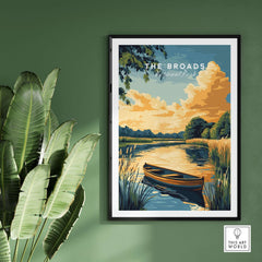 The Broads National Park Wall Art featuring a tranquil riverside scene with a boat and lush greenery.