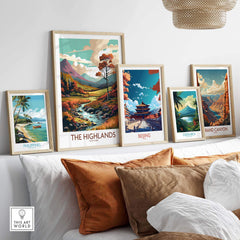 Display of framed travel art prints featuring The Highlands, Beijing, Costa Rica, Philippines, and the Grand Canyon.