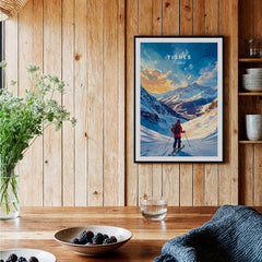 Tignes Ski Poster displayed in a cozy interior setting with wooden walls and a rustic table.