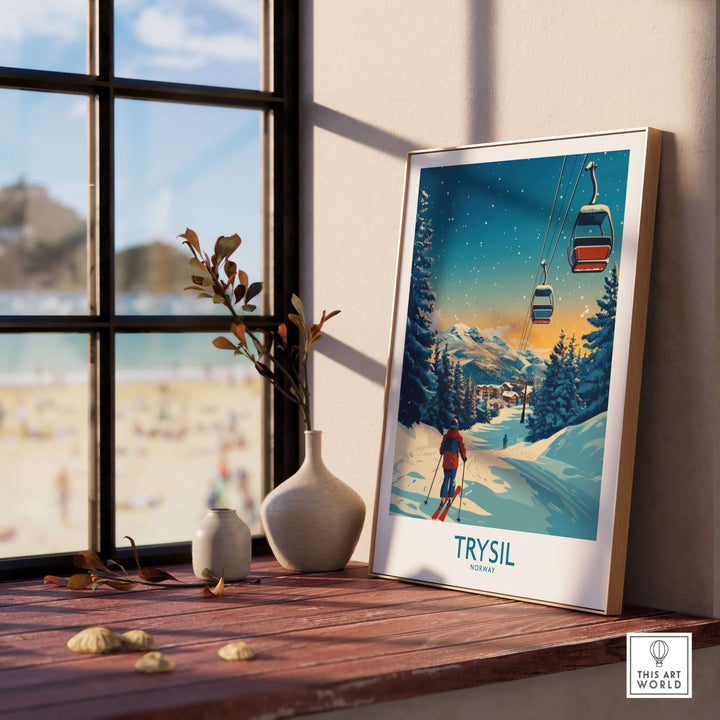 Trysil poster featuring skiing scene displayed on a wooden table by a sunny window, perfect for ski enthusiasts.