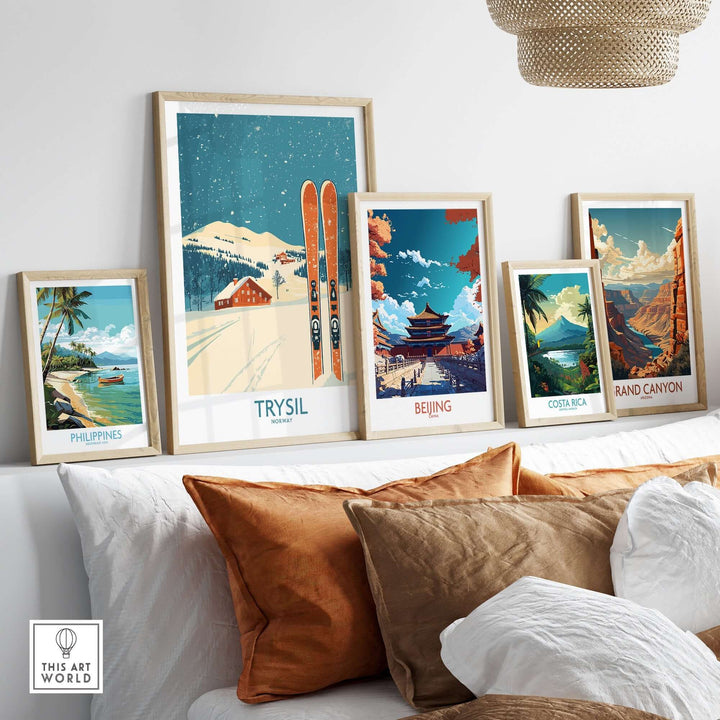 Collection of vintage travel posters including Trysil, Beijing, Costa Rica, and the Grand Canyon, displayed in modern frames.