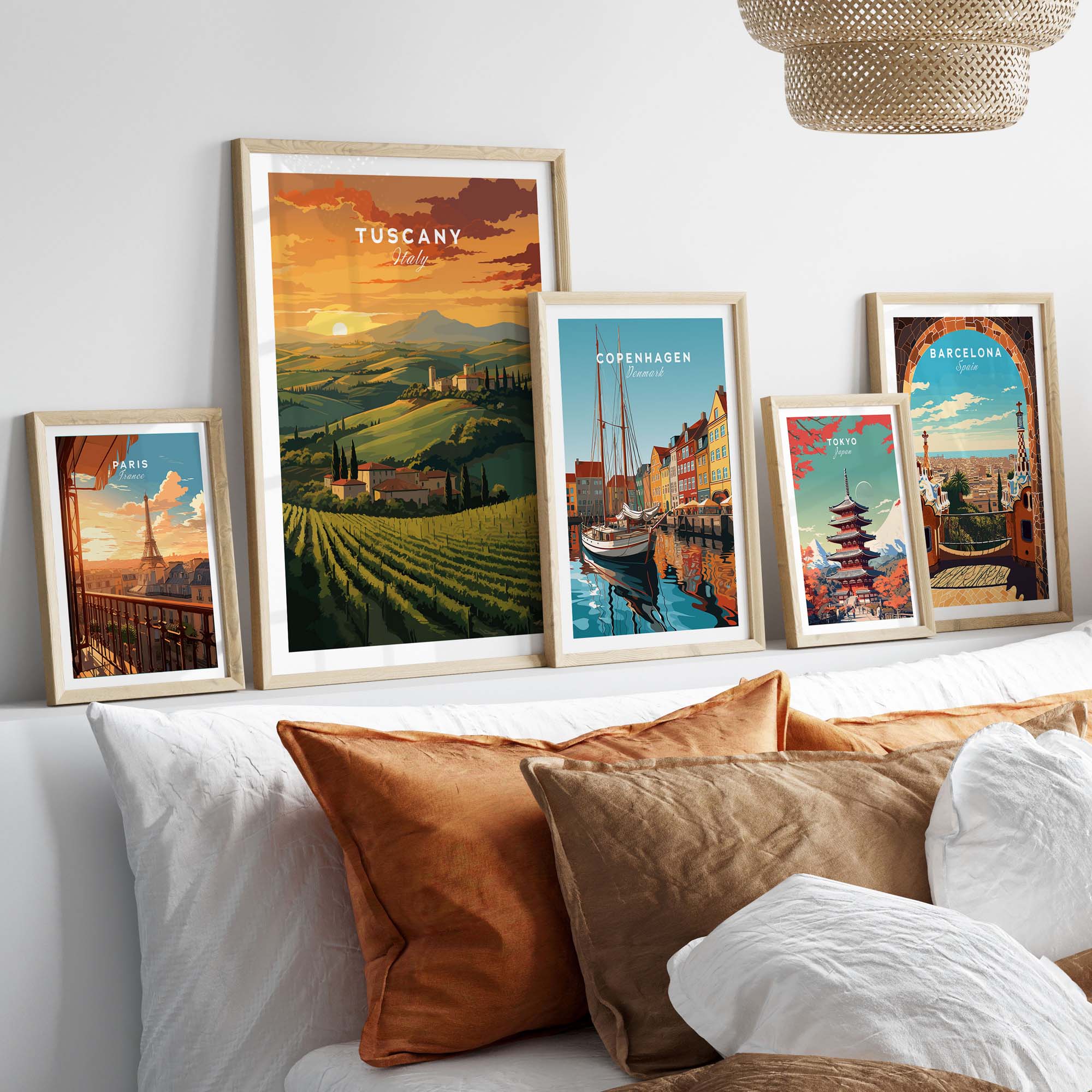 Tuscany wall art featuring sunset over rolling hills alongside framed city posters, enhancing home decor.