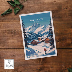 Val Cenis Ski Print on wooden surface, showcasing snowy mountains and cozy chalets, perfect for winter decor.