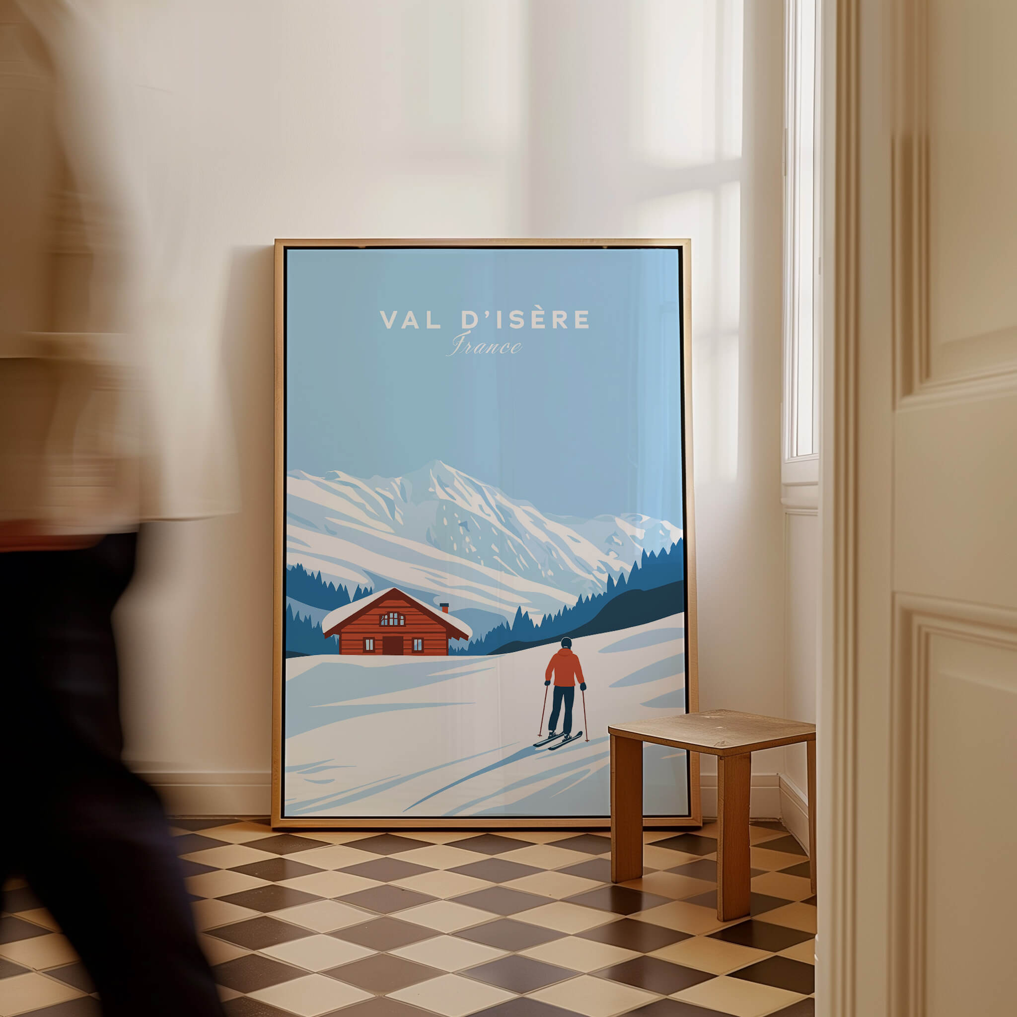 Val-d'Isère Poster France featuring a skier in front of a snowy landscape and a charming cabin.