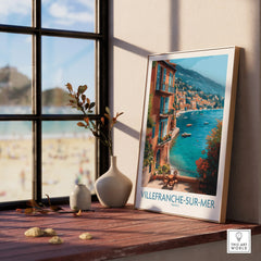 Framed Villefranche-sur-Mer travel poster in natural wood, displayed on window ledge with vases.