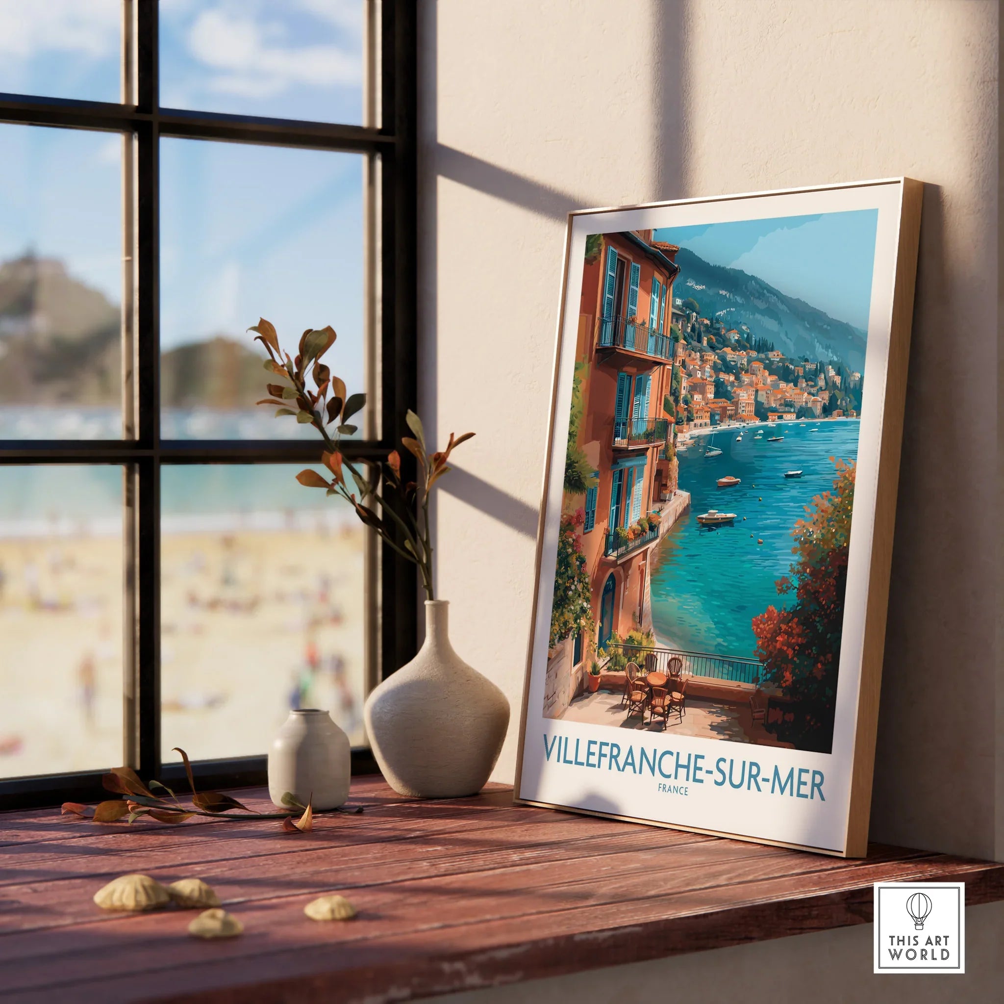 Framed Villefranche-sur-Mer travel poster in natural wood, displayed on window ledge with vases.