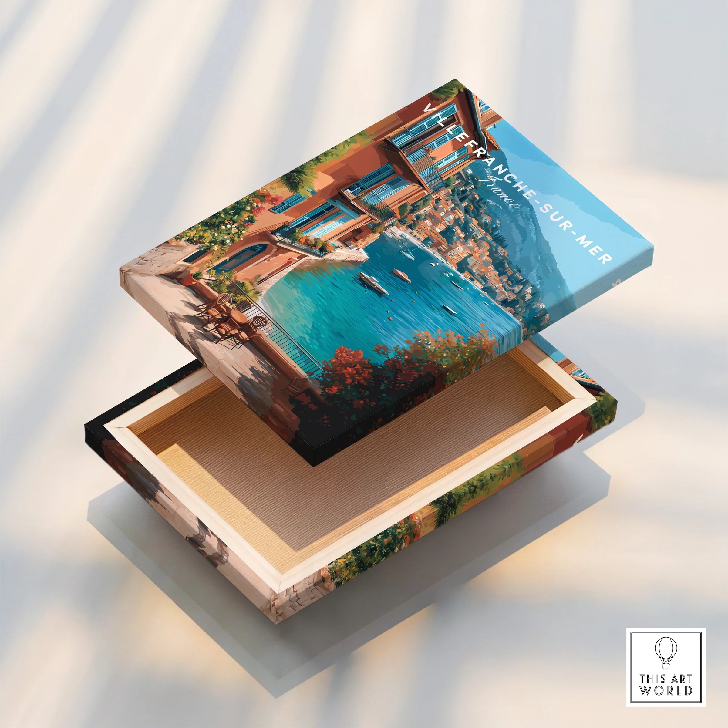 Villefranche-sur-Mer canvas print with colorful coastal buildings and blue sea, floating frame detail