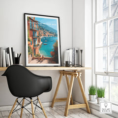 Villefranche-sur-Mer travel poster in black frame on modern office desk by window